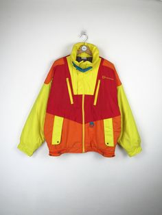 Sergio Tacchini vintage 90s ski jacket, yellow, orange and red. Zip closure, has 4 pockets, is padded. Made in Italy Size L Measurements (taken with the head lying flat) Shoulder width: 63 cm Sleeve length: 60cm Chest width: 65cm Length: 71cm Conditions: EXCELLENT - Shows signs of wear due to natural consumption Our garments are all vintage and second hand. Any signs of wear or defects are documented with photos and description. For any questions, photos, videos we are at your disposal. Orange Winter Windbreaker For Outdoor, Winter Orange Windbreaker For Outdoor, Vintage Windbreaker For Ski Season, Vintage Ski Season Windbreaker, Retro Yellow Windbreaker For Winter, 90s Style Yellow Winter Outerwear, 90s Yellow Winter Outerwear, 90s Yellow Windbreaker For Winter, Functional Yellow Windbreaker For Winter