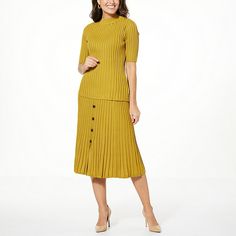 Nina Leonard 2-piece Mock Neck Top & Skirt Set  Made of a lightweight ribbed sweater knit, this perfectly matched top and skirt set solves your what-to-wear dilemma for any day of the week. Fitted Spring Workwear Sweater, Chic Midi-length Sweater For Spring, Casual Fitted Skirt For Layering, Chic Knee-length Spring Sweater, Spring Ribbed Stretch Skirt, Chic Knee-length Sweater For Spring, Fall Ribbed Midi Length Skirt, Spring Stretch Ribbed Skirt, Fitted Ribbed Knee-length Skirt