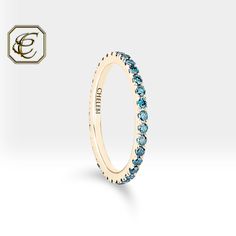 "Blue Diamond Tiny Ring / 14K Gold Ring / Natural Diamonds Half Eternity Ring / Birthday Gift Stackable Ring / Fine Jewelry By Chelebi Jewelry Studio  Blue Diamond Eternity Ring is set with natural blue diamonds and it is 14K Solid Gold.  There is no diamond on the bottom of the ring. Half (4/3) of the ring is diamond.                          DETAILS  ✶ Gold Kt: 14K Solid Gold ✶ Gold Color: Yellow, Rose, White Gold  ✶ Diamond: Natural Diamond ✶ Diamond Color & Clarity: Blue - Vs2 ✶ Diamond Shape: Round  ✶ Diamond Total Carat: 0.51 ct ✶ Diamond Quantity: 33 pcs  ✶ Diamond Size: 1.5 mm ✶ Setting Type: Micro Pave Setting ✶ Ready to Ship in 1-3 Business Days If you have any additional questions about this jewelry, just hit the \"MESSAGE CHELEBI\" button and we will get back to you within a fe 14k Gold Eternity Band With Birthstone, Yellow Gold 14k Eternity Band With Birthstone, 14k Yellow Gold Eternity Band With Birthstone, Yellow Gold Eternity Band With Birthstone For Promise, Yellow Gold Halo Eternity Band Gift, 14k Gold Eternity Band With Halo As A Gift, Promise Ring Eternity Band With Birthstone In Yellow Gold, Yellow Gold Eternity Band With Halo As Gift, Yellow Gold Eternity Band With Halo For Gift