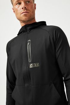 a man wearing a black hoodie with the letter l on it's chest