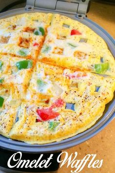 a pizza sitting on top of a pan covered in cheese and veggie toppings