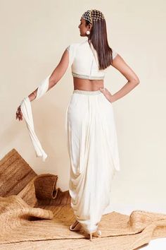 Shop for Reeti Arneja Ivory Georgette Enigma Embroidered Crop Top With Dhoti Skirt for Women Online at Aza Fashions Traditional Drape Pre-draped Saree In Off White, Fitted Pre-draped Saree With Side Open, Festive Fitted Sets With Draped Sleeves, Fitted Draped Unstitched Blouse Set, Fitted Draped Set With Unstitched Blouse, Fitted Sets With Draped Sleeves, Fitted Sets With Draped Sleeves For Wedding, Fitted Wedding Sets With Draped Sleeves, Traditional Fitted Draped Sets