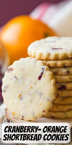 cranberry - orange shortbread cookies are stacked on top of each other with the words, cranberry - orange shortbread cookies