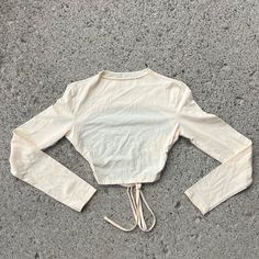 Cream Crop Top With Exposed Cut Out Back And Lace Up Tie. Size Medium And Large. Brand New With Tags. Fitted Crew Neck Crop Top For Vacation, Beige Cotton Tops By Urban Outfitters, Urban Outfitters Beige Cotton Tops, Beige Cotton Tops From Urban Outfitters, Urban Outfitters Cotton Crop Top, Cream Cropped Cotton Tops, Cream Crop Top, Floral Peplum Top, Open Front Sweater