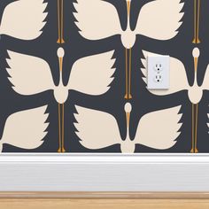 the wallpaper is designed with white birds and black background, as well as a light switch