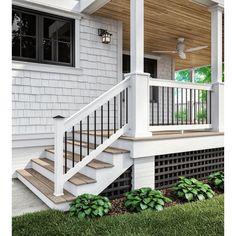 a porch with white railing and wooden steps