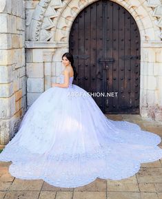 A dramatic ball gown that will make you feel like a real princess. This stunning dress is accented with sheer petal lace appliques along the bodice and the full tulle skirt. The v-neckline features metallic lace appliqués with subtle hints of sparkles on the diamond tulle. This dress comes with a coordinating separate cape. House of Wu Quinceanera Collection Fall 2022 Style Number: 26040C Fabric: Tulle/Metallic Lace Colors: Lilac/Silver, Sky/Silver Sizes Available (as of 12/8/2024): 6, 8, 10 Occ