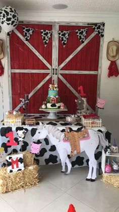 a decorated table with cow and horse decorations