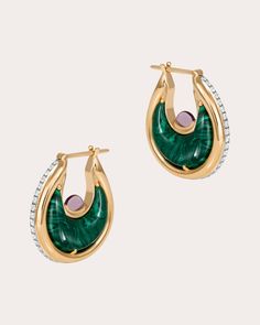 An expert display of artisanal craftsmanship, the Diana earrings detail their 18-karat gold base with inlaid green malachite. Amethyst cabochons rest in the inner curves while pavé-set white diamonds decorate the outer edges. From L'Atelier Nawbar's Lot N*91 Collection, a heartfelt tribute to bold, '80s-inspired glamour. Latch closure 18k yellow gold, malachite, amethyst and white diamond Diamond carat: 0.13 ctw Diamond color: G Diamond clarity: VS1 Polish with soft cloth Handmade in Lebanon Measurements Width: 0.11in Length: 0.59in Luxury Green Earrings With Polished Finish, Luxury Round Malachite Jewelry, Luxury Malachite Jewelry, Elegant Gold Malachite Earrings, Elegant Malachite Earrings, Diana Earrings, Green Malachite, Diamond Carat, Art References