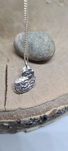 The molten heart necklace made using sterling silver. This pendant is unique in its own, it is melted which created this organic look. This can wear on it's  own or can wear layered.  This is made using solid sterling silver which give you a fair weight. Ideal gift for special occasion.  This will come in a gift boxed. Hand Cast Sterling Silver Heart Jewelry, Unique Sterling Silver Necklace With Heart Charm, Hammered Silver Heart Jewelry, Heart-shaped Hammered Sterling Silver Jewelry, Unique Heart-shaped Sterling Silver Necklace, Unique Silver Heart Pendant Necklace, Silver Cat Pendant, Cat Necklace Silver, Sterling Silver Cat