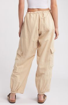 Elevate your casual wardrobe with these drawstring-waist cargo pants crafted from fresh, lightweight cotton in a baggy silhouette. 31 1/2" inseam; 17" leg opening; 10 1/2" front rise; 15 1/2" back rise (size Medium) Exclusive retailer Zip fly; drawstring waist Front slant pockets; cargo flap-patch pockets 100% cotton Machine wash, line dry Made in Turkey Cotton Cargo Pants, Bdg Urban Outfitters, Urban Outfitters Pants, Easy Trendy Outfits, Cargo Pants Women, Loungewear Shorts, Designer Clothes For Men, Modern Outfits, Bottom Clothes