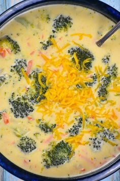 broccoli and cheese soup in a blue bowl