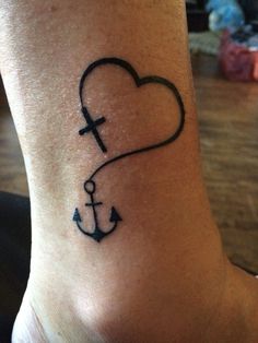 a small anchor and heart tattoo on the ankle