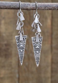 Antiqued, ethnic inspired silver dangle earrings.Light weight silver dangle earrings made with an ethnic inspired, double sided triangle and tiny, antiqued silver dangles. Perfect everyday earrings that will add a bit of southwestern, boho vibe to your favorite outfit. Also makes a great gift idea for anyone who loves rustic silver jewelry.Product overview:- Made with antiqued silver and non-tarnish silver plated brass- Very light weight and versatile- Total hanging length approximately 2.25"- H Silver Boho Jewelry, Earthy Earrings, Drop Earrings Silver, Stone Dangle Earrings, Precious Metal Clay, Red Jewelry, Silver Dangle Earrings, Colorful Earrings, Western Jewelry