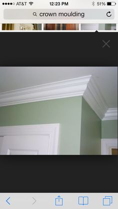 the crown moulding on this room is painted green and has white trim around it