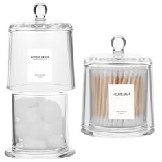 cotton swabs in a glass container next to an empty jar