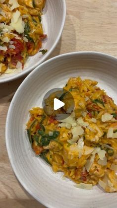 two white bowls filled with food on top of a wooden table