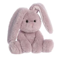 a pink stuffed rabbit sitting up against a white background