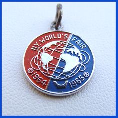 a red, white and blue world's fair badge on a leather background with the word my world's fair written below it