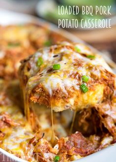 loaded bbq pork potato casserole is being lifted from the casserole dish