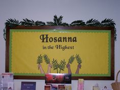 there is a sign that says hosanna in the highest surrounded by other books