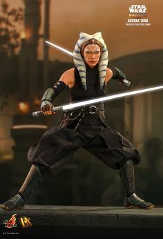 the action figure has two swords in his hands