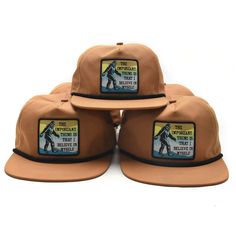 The important thing is that you believe in yourself! Bigfoot sure does! Made from 100% quick-dry nylon, this cap is ready for some trekking. -woven patch with merrowed edging -black rope and adjustable snapback closure. Brown Six-panel Snapback Hat For Outdoor, Adjustable Snapback Hat For Outdoor, Adjustable Baseball Cap With Logo Patch For Outdoor Activities, Adjustable Baseball Cap With Logo Patch For Outdoor, Adjustable Brown Trucker Hat For Camping, Brown Snapback Trucker Hat For Hiking, Adjustable Baseball Cap For Hiking, Adjustable Snapback Baseball Cap For Hiking, Adjustable Brown Snapback Hat For Hiking