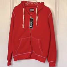 This Is A Nwt Red Hoodie With White Contrast Stitching Please Note One Side Of Drawstring Is Not Woven Correctly. Super Duper Soft Pockets And Full Zip Size Medium Unisex Red Cotton Hoodie With Double-lined Hood, Casual Red Fleece Hoodie, Casual Red Hoodie With Drawstring Hood, Casual Red Hoodie With Double-lined Hood, Red Casual Hoodie With Double-lined Hood, Casual Red Hoodie With Adjustable Hood, Red Casual Hoodie With Adjustable Hood, Red Cotton Sweatshirt With Double-lined Hood, Casual Red Hooded Jacket For Streetwear