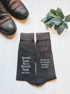 two socks that say special socks for a special walk on the floor next to a plant