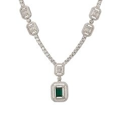 Elevate your elegance with the Evita Emerald Statement Necklace in Silver. This exquisite piece redefines luxury with its tennis necklace design. The centrepiece is a breath-taking pendant drop, featuring two distinct rectangular settings. The larger setting cradles a stunning lab-grown emerald, enveloped by two dazzling rows of zircons. This masterpiece gracefully connects to a smaller rectangular setting, where baguette-cut zircons are framed by a single row of glistening zircons.  Adding to i Luxury Gemstone Tennis Necklace, Elegant Diamond Jewelry With Rectangular Stone, Elegant Rectangular Diamond Jewelry, Luxury Formal Diamond Necklace With Rectangular Pendant, Luxury Baguette-cut Emerald Necklace For Formal Occasions, Luxury Baguette Cut Emerald Necklace For Formal Occasions, Luxury Diamond Necklace With Rectangular Pendant For Formal Events, Luxury Diamond Necklace With Rectangular Pendant For Formal Occasions, Luxury Emerald Cut Diamond Necklace For Formal Occasions