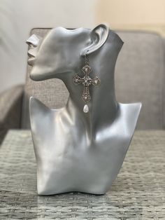 Large cross earrings with iridescent rhinestones and drop pearls The cross is zinc alloy Pearls are plastic but very well finished Elegant Pierced Cross Jewelry, Elegant Cross Pendant Jewelry For Pierced Ears, White Cross Jewelry With Pearl Drop, Silver Cross Jewelry With Pearl Drop, Elegant Pearl Drop Cross Jewelry, White Cross Jewelry For Party, Elegant Pierced Cross Earrings, Elegant Cross Pendant Earrings, Elegant Cross Pendant Jewelry For Party