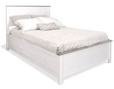 a white bed with two pillows on top of the headboard and foot board is shown