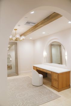 a large mirror and vanity in a room