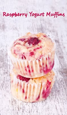 two raspberry yogurt muffins stacked on top of each other