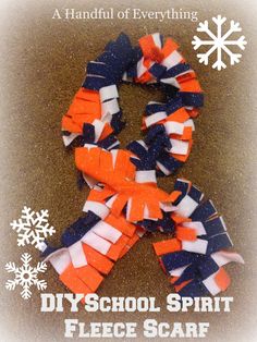 an orange, white and blue ribbon with snowflakes on it that says diy school spirit fleece scarf