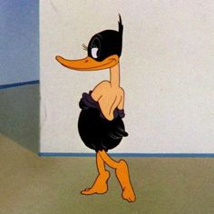 a cartoon duck is standing in front of a white wall and looking at the ground