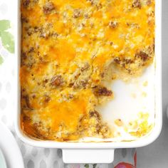 a casserole dish with meat and cheese in it