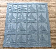 a piece of cloth with sailboats on it