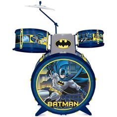 the batman drum set is on display in front of a white background with blue and yellow accents