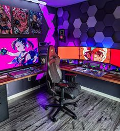 a gaming room with multiple monitors and desks