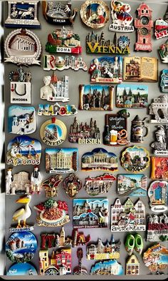 a refrigerator covered in magnets and pictures