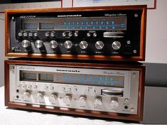 two old fashioned stereo equipment sitting on top of each other