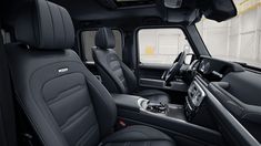 the interior of a truck with black leather seats