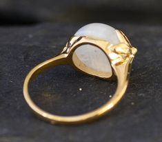 Gold Leaf Ring set with a Natural Rainbow Moonstone - with a nice flash, at size 12mm (8 Cts) from Madagascar.Gold Vermeil: 18k Gold over Solid 925 Sterling Silver ☞ made to last. Matching Earrings ☞ please ask meMatching Pendant ☞ please ask me Details:• Natural Moonstone sourced from Madagascar• Moonstone: 12mm, 8 Cts, round cabochon cut• Dimensions: Band width ≈ 2.4mm, thickness ≈ 1.2mm• 18K Gold Vermeil❀ Each Natural Gem is unique & will have Slight variations from the product pictures "no t Hallmarked Yellow Gold Moonstone Ring, Elegant Untreated Moonstone Ring, Gold Leaf Ring, Gold Leaf Rings, June Birthstone Ring, Rainbow Moonstone Ring, Leaf Ring, June Birthstone, Natural Rainbow