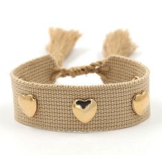 Crafted with an adjustable woven wristband, this bracelet features golden heart-shaped metal rivets and a decorative tassel that is sure to make your girls trip, girls weekend or girls getaway unforgettable. Thoughtful and trendy, this bracelet makes the perfect gift for your bridal party. A sweet gift for your rehearsal dinner, wedding weekend or bachelorette trip gift! Please make any requests known to me in the box provided at the check out window! This listing is for:1 woven thread bracelet Trendy Woven Jewelry For Gift, Trendy Woven Jewelry As A Gift, Casual Gold Woven Jewelry, Trendy Woven Jewelry For Festivals, Gold Woven Braided Bracelets For Friendship, Casual Woven Bracelets, Casual Woven Bracelet, Gold Woven Bracelets For Friendship, Trendy Bracelets With Adjustable Length For Festivals