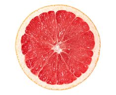 a grapefruit cut in half on a white background