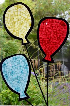 stained glass window with two balloons in the middle and words balloon stained glass window on it