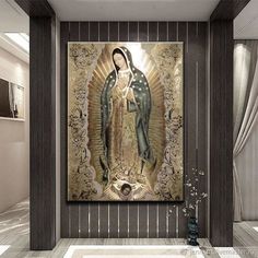 an image of the virgin mary on display in a room with tile flooring and walls