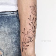 a woman with a flower tattoo on her arm