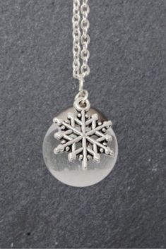 Frozen snowflake in liquid glass ball pendant.Winter Pendant gift for her.  #snowflake #Winter #Pendant Silver Jewelry As Winter Gift, Silver Jewelry For Winter Gift, Silver Snowflake Necklace For Gift, Round Winter Jewelry Gift, Round Jewelry Gift For Winter, Winter Sterling Silver Necklace, Nickel-free Silver Necklace For Christmas, Nickel-free Silver Necklaces For Christmas, Sterling Silver Necklace For Winter